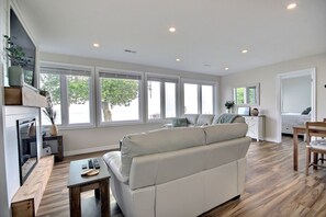Living area - Peaceful lakefront getaway- lake access, fire pit, kayaks, views & cozy comfort. (Selkirk)
