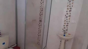 Shower, towels, soap, toilet paper