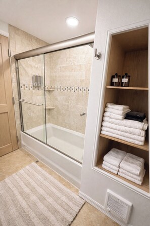 Shower, hair dryer, towels, soap