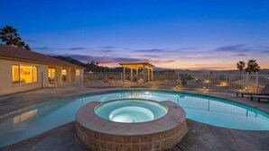 A swimming pool with a hot tub, a covered seating area, and a fenced patio. - Casa Selecta - Hot Tub, Game Room & Pool (Yucca Valley)
