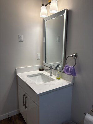 Shower, towels, soap, toilet paper
