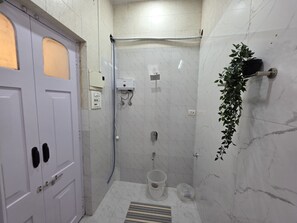 Shower, towels, soap, toilet paper