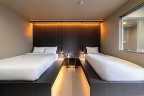 A modern hotel room with two single beds, a small table with a vase, and a large window. - Haechi Stay (Seoul)