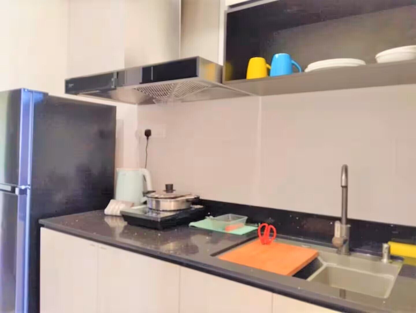 Fridge, stovetop, electric kettle, cookware/dishes/utensils