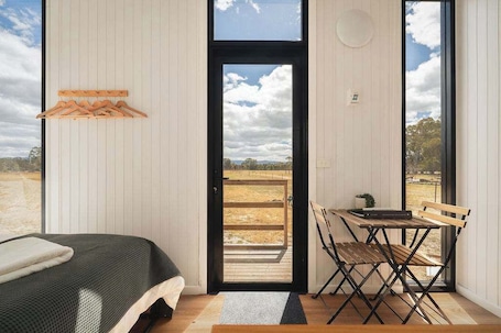1 bedroom, bed sheets. Bellellen Park 1 by Tiny Away