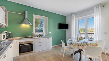 Family Apartment, Multiple Bedrooms, Mountainside (Appartamento Girasole) | Private kitchen | Fridge, microwave, oven, stovetop