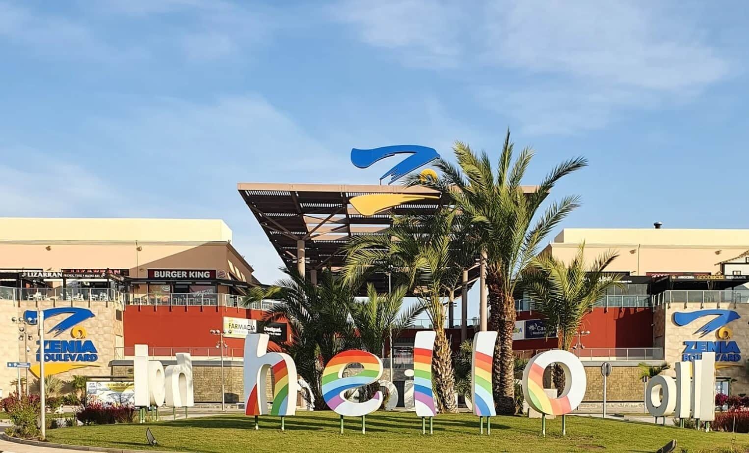 A building with a 'Zenia Boulevard' sign, a 'Burger King' sign, and a 'Pizza Hut' sign.