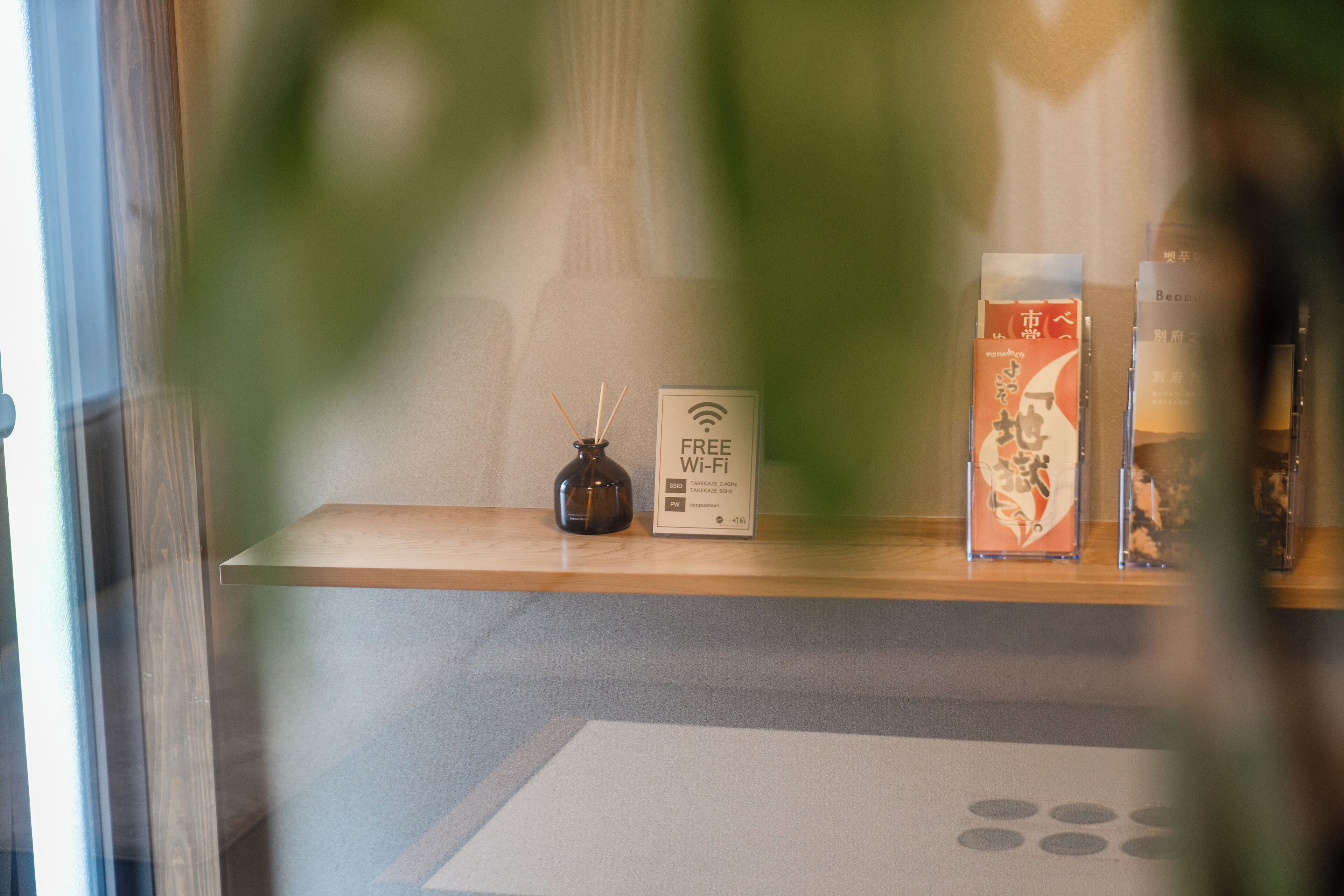 A reception area with a wooden counter, a Wi-Fi sign, and some informational posters.
