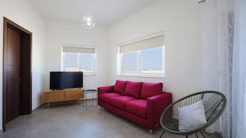 Penthouse - utsikt mot staden | Vardagsrum