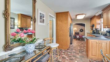 Fridge, stovetop, dishwasher, coffee/tea maker