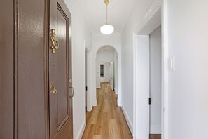 Central hallway linking the front rooms to the main living spaces.