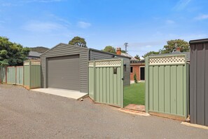 Shows controlled rear access to the property and garage.