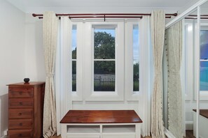 Bedroom window area with added seating and useful storage.