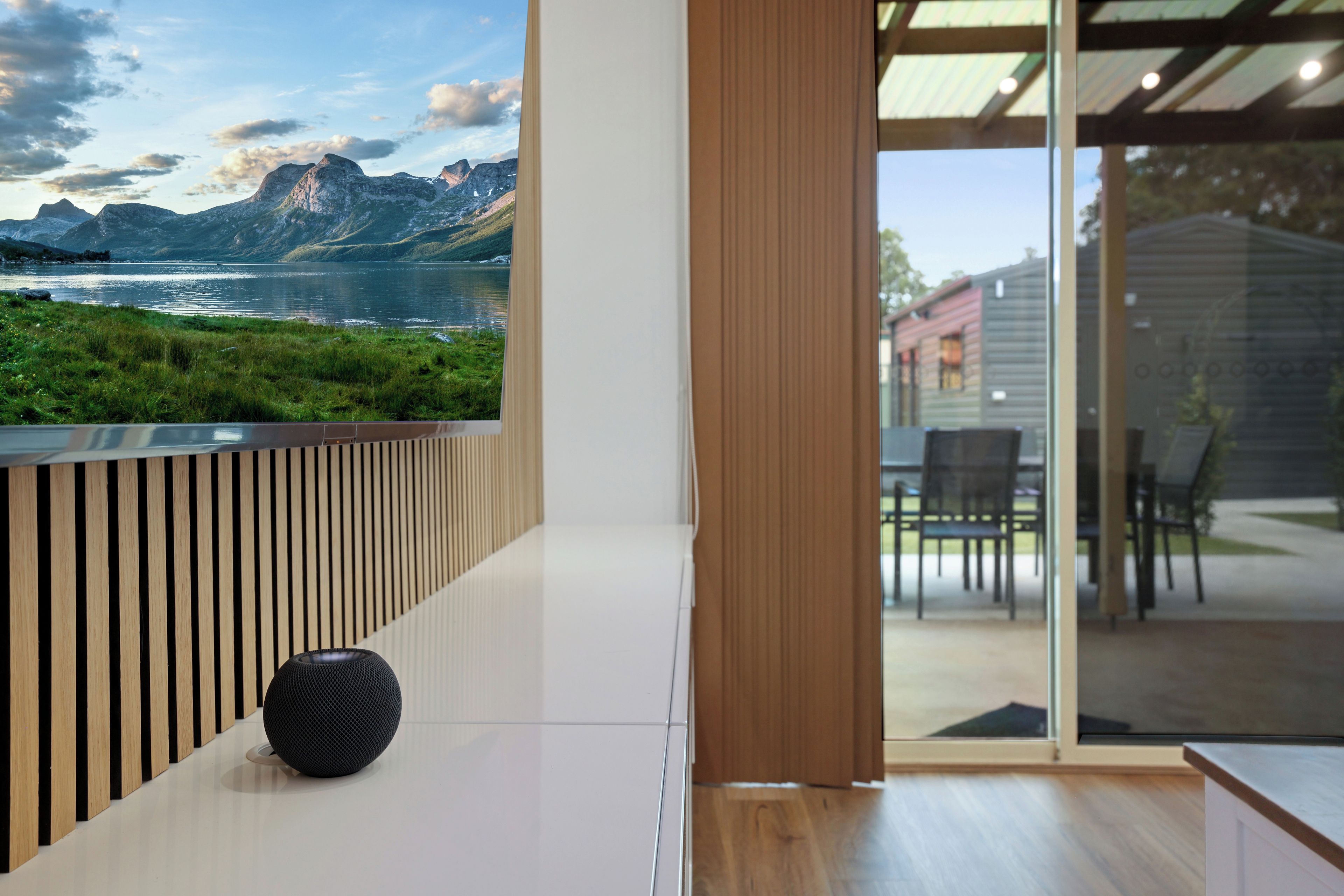 Living room detail showing integrated audio and outdoor connection.