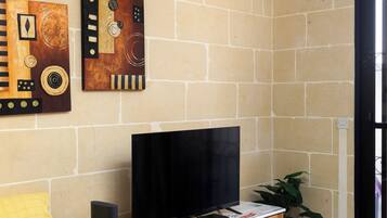 Apartamento, vista para a cidade | Área de estar