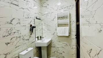 Family Quadruple Room, Balcony, City View | Bathroom | Shower, hair dryer, towels, soap
