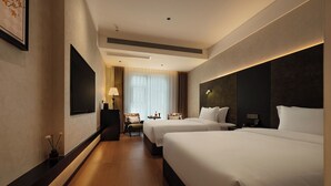A hotel room with two beds, a flat-screen TV, a desk, and a window with curtains. - Zhangjiajie JIMO HOTEL (Zhangjiajie)