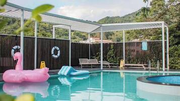 Seasonal outdoor pool, open 2:00 PM to 6:00 PM, pool umbrellas