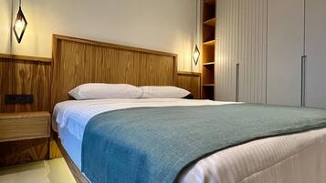 Family Suite, Sea View | Premium bedding, in-room safe, blackout drapes, iron/ironing board