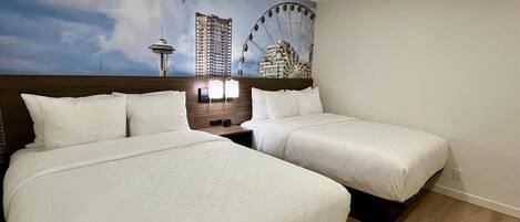 Suite, varias camas, para no fumadores (Efficiency) | Escritorio, cortinas blackout y tabla de planchar con plancha