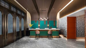A modern kitchen with a marble countertop, two bar stools, and a decorative backsplash. - Days Inn by Wyndham Changsha Kaifu (Changsha)