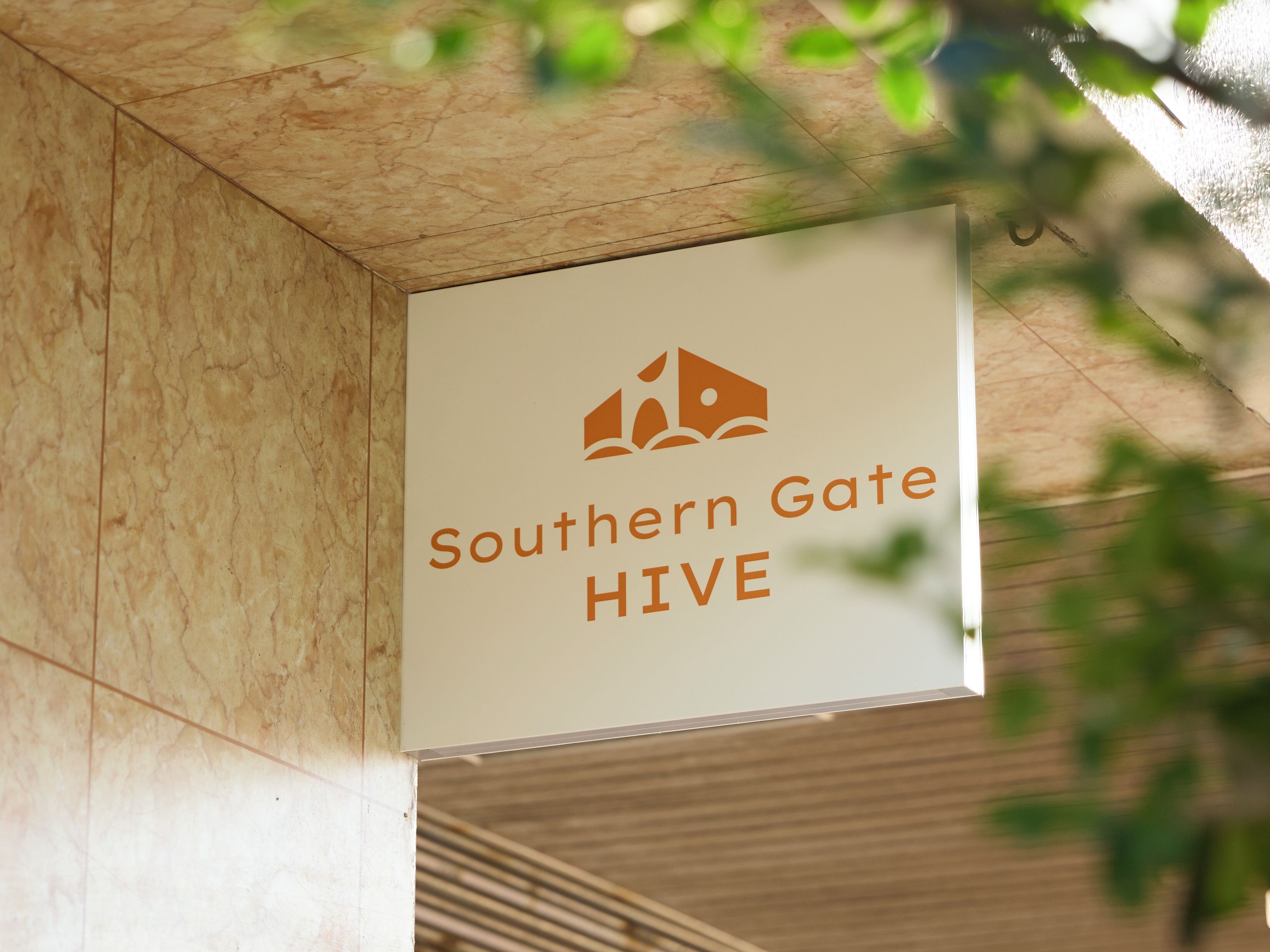 A sign with the text "Southern Gate HIVE" and a logo.