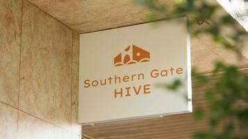 A sign with the text "Southern Gate HIVE" and a logo.