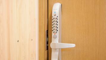 A door with a modern keypad lock and a lever handle.
