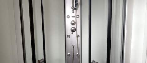 Shower, hair dryer, towels, toilet paper