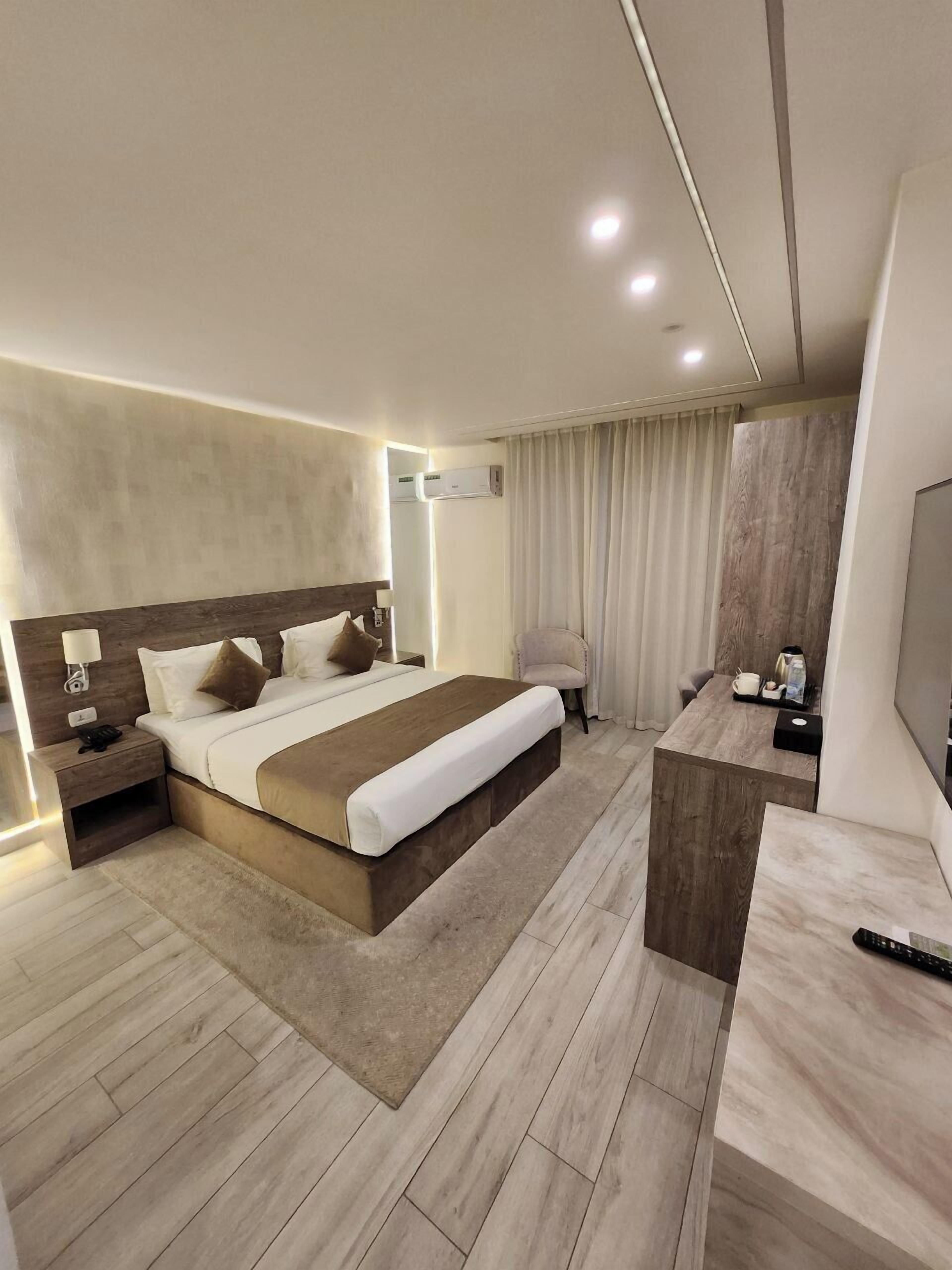 Executive Apartment, City View | In-room safe, desk, iron/ironing board, free WiFi