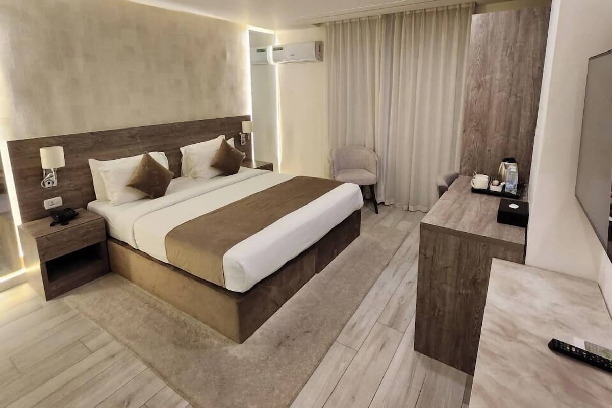 Executive Apartment, City View | In-room safe, desk, iron/ironing board, free WiFi