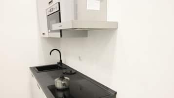 Estúdio luxo | Cozinha privada | Micro-ondas, fogão, cooktop, talheres/pratos/utensílios de cozinha