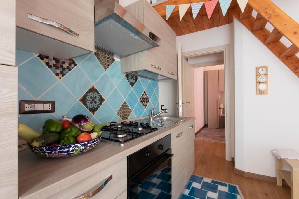 Deluxe Apartment, Patio, Garden View | Private kitchen | Highchair