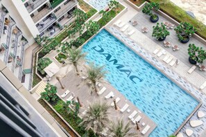 Pool - Chic and Cozy 1BR Retreat - Canal and City View (Dubai)