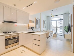 Fridge, microwave, oven, stovetop - Luxury 1BR Haven in Binghatti Emerald - JVC (Dubai)
