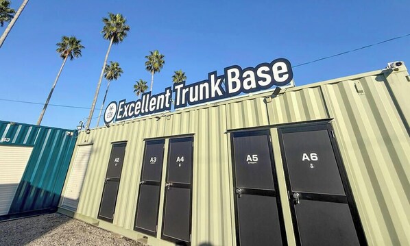 A building with a sign reading 'Excellent Trunk Base' and numbered windows labeled A1 to A6. - Excellent Trunk Base Miyazaki Airport (Miyazaki)