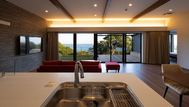 A modern kitchen with a large sink, wooden beams, and a view of the outdoors. - Workation Resort THE Forest (Nagatoro)