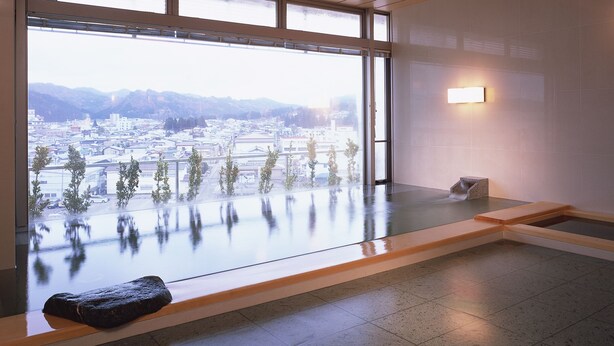 A modern indoor space with a large window overlooking a cityscape. - Hotel Ladies Plaza Yokote (Yokote)