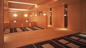 A wooden interior with a reception desk, seating area, and a wooden floor. - Hotel Ladies Plaza Yokote (Yokote)