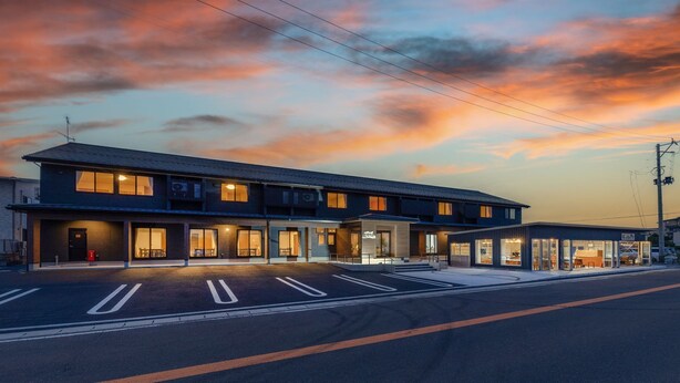 A modern two-story hotel with a flat roof and large windows. - Ryokan-isamiya (Soma)