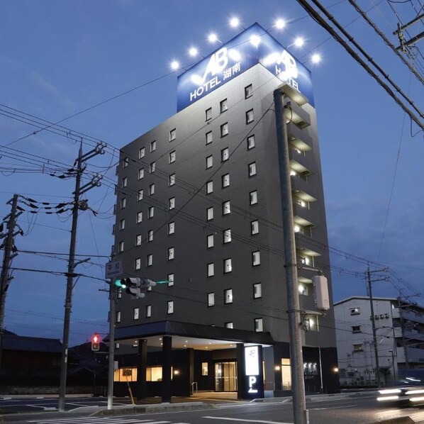 A multi-story hotel building with a prominent sign at the top. - AB Hotel Konan (Konan)