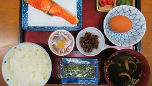 A tray with various food items including salmon, rice, and a bowl of soup. - Business Hotel Mikumo (Konan)
