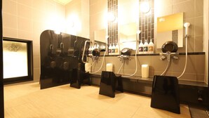 A modern bathroom with multiple sinks, mirrors, and hair dryers. - AB Hotel Kani (Kani)