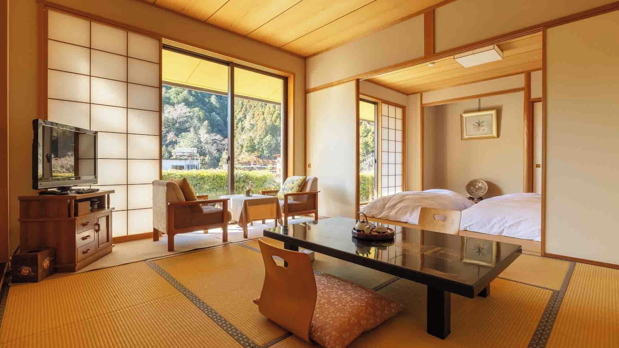 A traditional Japanese-style room with tatami flooring, a low table, a sofa, and a bed.