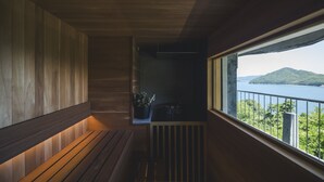 A balcony with a view of a body of water and a distant island. - Seki Syu Kan (Mitoyo)