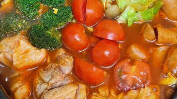 A pot of stew with various vegetables and meat.