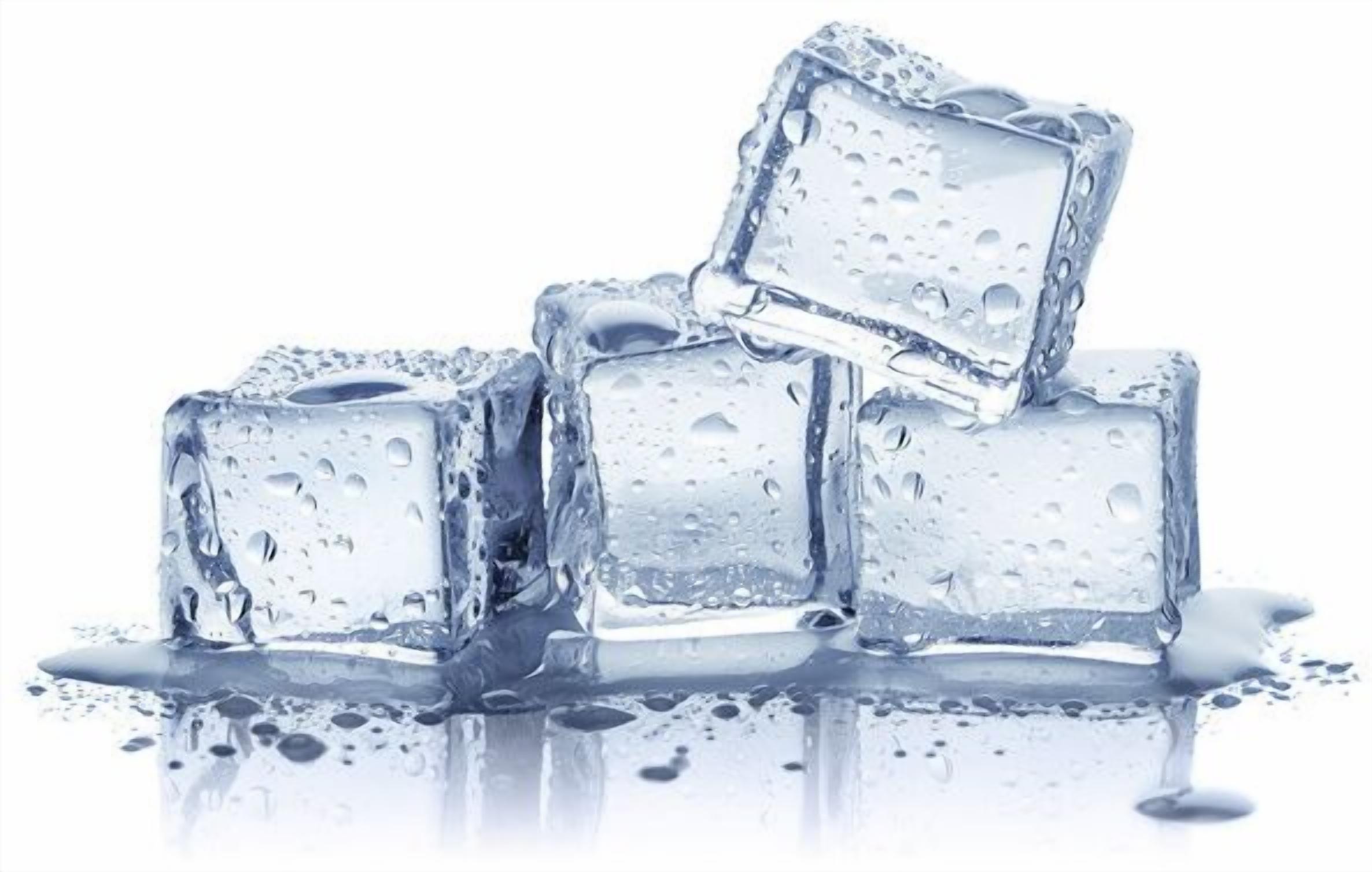 Ice cubes with water droplets on them.