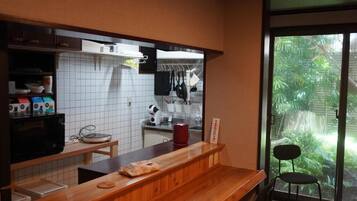 Full-size fridge, microwave, stovetop, cookware/dishes/utensils