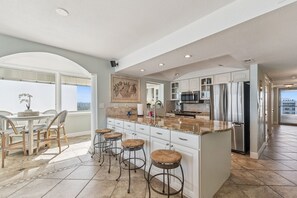 Fridge, microwave, oven, stovetop - Southeast Serenity-Luxury Oceanfront Condo | New Smyrna Beach 1 Bedroom | 1 Bathroom (New Smyrna Beach)
