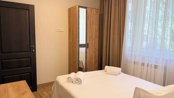 Family Apartment, 2 Bedrooms, Kitchen, Courtyard View | Blackout drapes, soundproofing, iron/ironing board, free WiFi